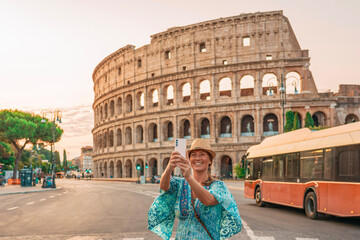 08 08 2025 Rome, Italy - Traveler in hat exploring Colosseum landmark