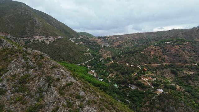 Aerial Landscape views of Ojen town. Ojen is a town and municipality that sits in the mountains behind Marbella in the autonomous community of Andalusia in southern Spain. Ambient drone exploration.