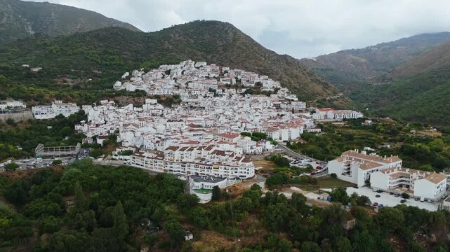 Aerial Landscape views of Ojen town. Ojen is a town and municipality that sits in the mountains behind Marbella in the autonomous community of Andalusia in southern Spain. Ambient drone exploration.