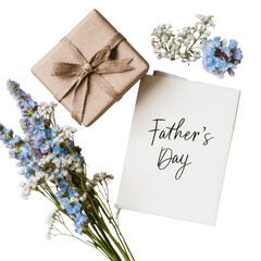 A beautiful arrangement featuring a Father's Day card, flowers, and a neatly wrapped gift rests on a clean surface
