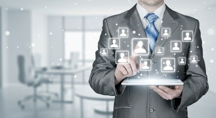 Man in suit interacts with digital interface showing profile icons in office.