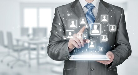 Businessman holds tablet with social network icons in an office setting.