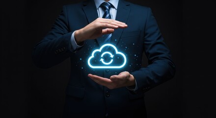 Man in suit protects glowing cloud icon representing cloud computing technology.