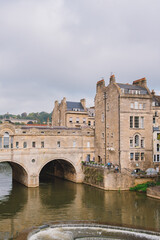 Pulteney Bridge in wonderful day, perfect for sightseeing, as viewed from the Parade Gardens, Bath, England.