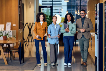 Diverse Team Walking Through Modern Office Lobby For Meeting, Collaboration, And Innovation