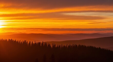 Vibrant orange sunset over silhouetted mountain ranges and a pine forest. Scenic wilderness landscape with a colorful sky at dusk