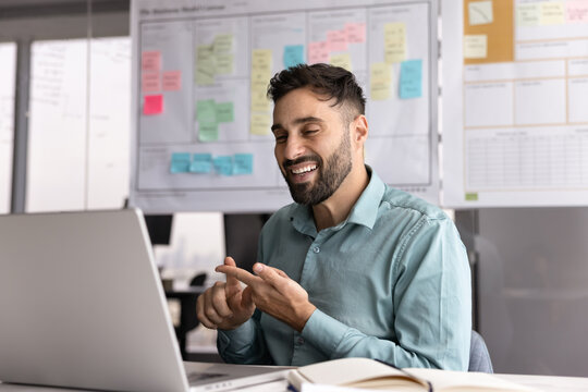 Businessman with hearing disability communicate by videocall using sign language