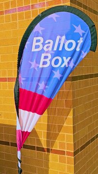 Vertical sturdy outdoor mail-in ballot drop box marked &ldquo;Official Ballot Drop Box&rdquo; and &ldquo;Buz&oacute;n de Boleta Oficial,&rdquo; providing voters a safe, official and convenient way to submit election ballots by mail
