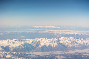 Obraz premium Plane Window View, Snow Mountains Aircraft Fly Landscape, Looking from Plane Cabin