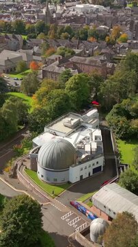 Wide advancing social ratio 60FPS aerial of Armagh Planetarium in County Armagh, Northern Ireland. Produced in 1080x1920 with broadcast ready Rec709 color.