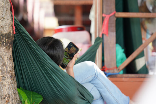 young woman relaxing in hammock