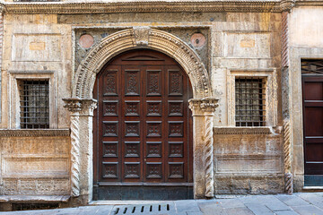 Facade of Casa Pigafetta showcasing detailed architecture in Vicenza, Italy on a sunny day