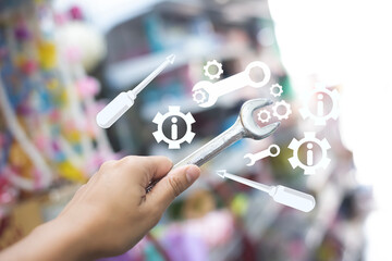 Hand Holding Wrench with Digital Maintenance and Repair Icons