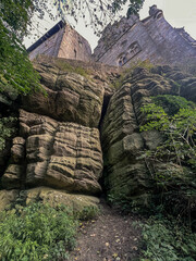 rocks in the forest with castle on top