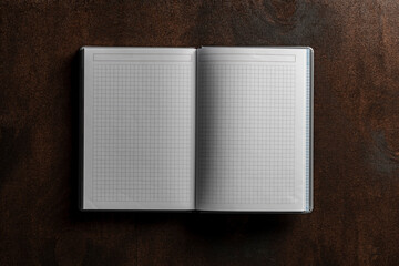 Open notebook with checkered sheets on wooden texture background, closeup, top view, copy space