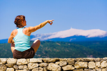 Woman enjoying mountain nature view in France