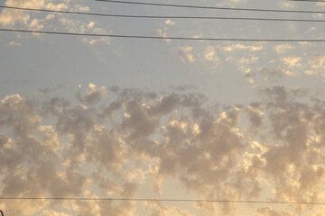 Sky with beautiful cumulus clouds. Sunset sky. Natural photo.