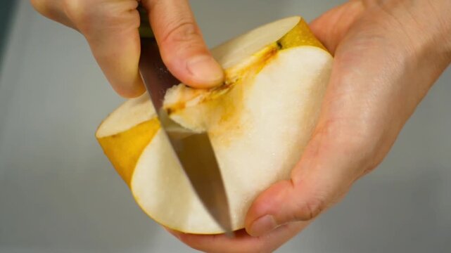  Cut and remove seeds from a pear. Asian pears, nashi pear, organic fruit