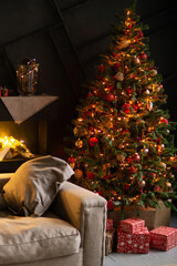 Christmas tree decorated with festive ornaments and lights. Cozy festive home interior with sofa and fireplace for holiday celebration.