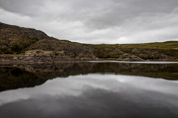 Glacial lagoon of Sotillo de Sanabria with reflections on a cloudy autumn day