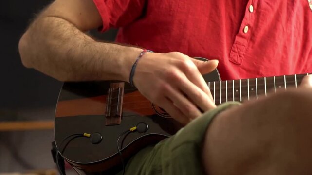 Playing the ukulele in a relaxed and comfortable setting at home