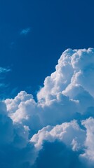 Bright blue sky with large white cumulus clouds in sunlight, symbolizing purity, peace, and optimism. Perfect for nature, travel, environment, wellness, and inspirational design with copy space.