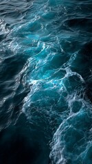 Deep blue ocean water with dynamic waves and white foam texture, symbolizing nature, power, and freedom. Perfect for travel, marine, wellness, or environmental design with copy space for text.