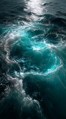 Aerial view of swirling turquoise ocean water with waves and foam, symbolizing motion, energy, and natural power. Perfect for travel, marine, wellness, and environmental design with copy space.