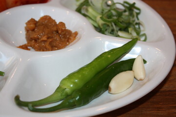 South Korean Food Dwaeji Gukbap Side Dishes: Ssamjang, Vegetables, and Kkakdugi Kimchi