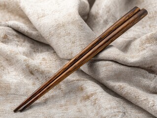 Dark Wood Chopsticks Gracefully Resting Beige Linen Fabric Textured Background Oriental Dining Utensil Asian Cuisine Tool Earthy Tones Culinary Instrument Flat Lay View Traditional Element