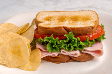 ham sandwich with a side of  fries