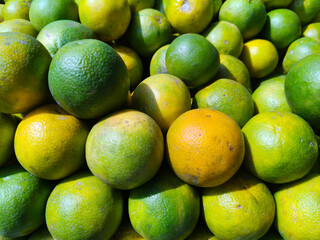Close up shot of pile of fresh sweet lemon.