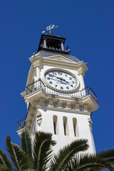 the facade of a clock tower in an ancient building in Valencia