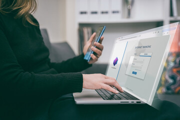 Woman makes an online payment using two-factor authentication. Girl entering a password on laptop...