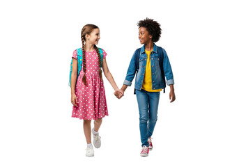 Two diverse young school children holding hands and walking together with backpacks isolated on transparent background