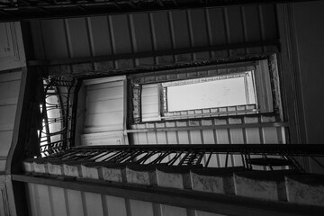 Black and White Spiral Stairwell with Decorative Railings