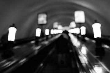 Blurred Underground Escalator with Lights and Motion in Subway Tunnel