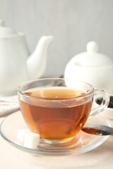 Delicious tea served on white table, closeup