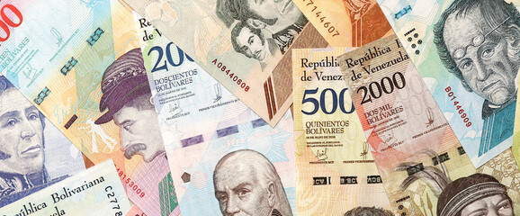 Venezuelan Bolivar currency money bills in big amount. Heap of VED currency banknotes with different denomination close up