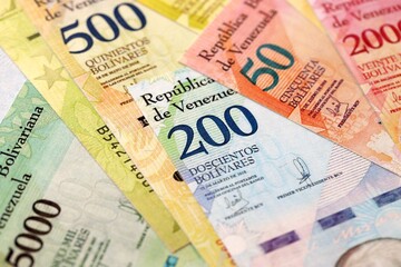 Venezuelan Bolivar currency money bills in stack. VED currency banknotes with different denomination close up