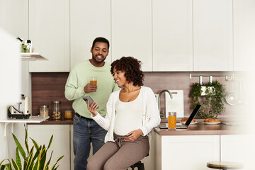 Expecting joy at home, an african american couple celebrates their pregnancy together