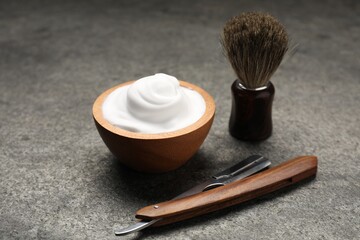 Different barber's tools on grey background, closeup