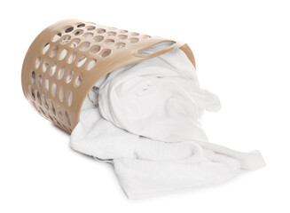 Overturned laundry basket with clothes isolated on white