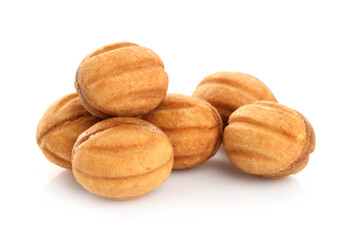Delicious nut shaped cookies with boiled condensed milk isolated on white