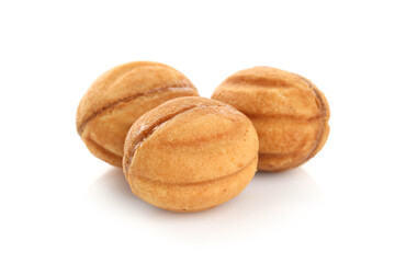 Delicious nut shaped cookies with boiled condensed milk isolated on white