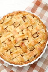 Delicious homemade apple pie on white wooden table, top view