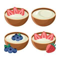 Four bowls of yogurt with fresh strawberries and blueberries