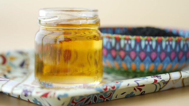 Organic Black Cumin Seed Oil in a jar 
