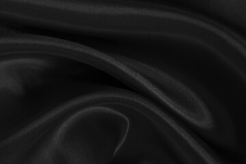 Black fabric cloth texture for background and design art work, beautiful crumpled pattern of silk or linen.