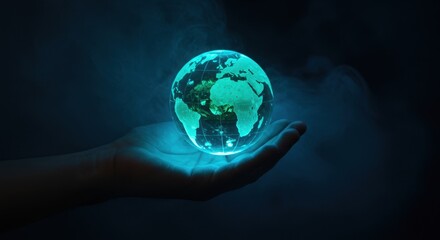 Hand holding a glowing earth globe. Concept for environment, ecology and climate.
